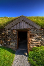 Replica Viking longhouse and longboat near Haroldswick.